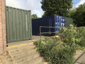 A wider image of three new 20ft shipping containers
