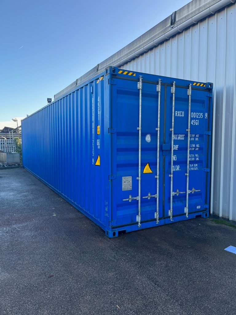 Side image of a new blue shipping container in Essex