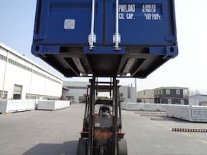 Shipping container on forklift