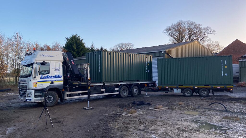 The arrival of 2x20ft containers to a site