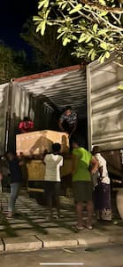 Image of people unloading a container in Far East