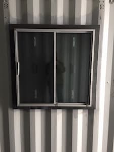 window in a modified 20ft container