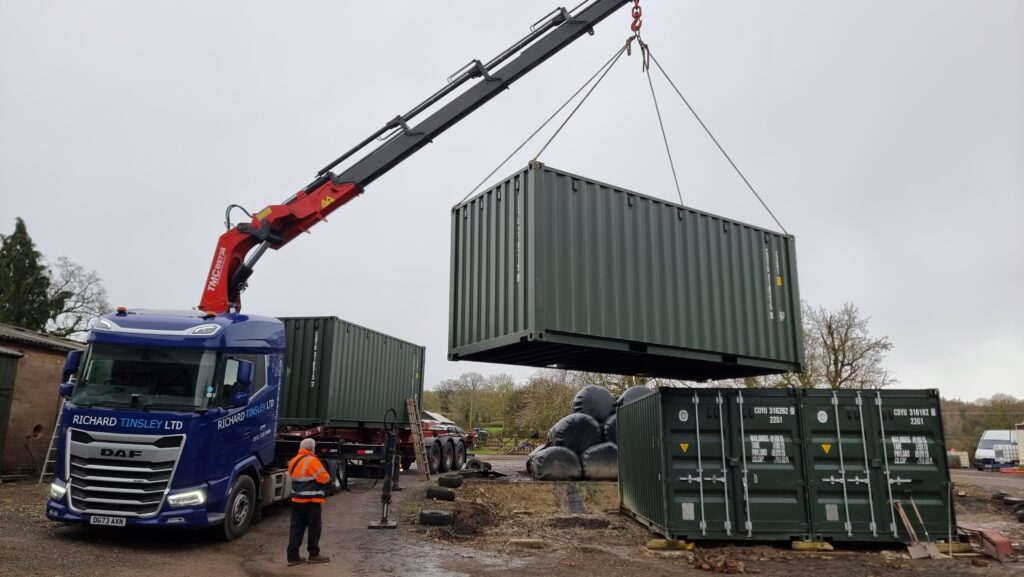The delivering of shipping containers to a farm in Leicestershire