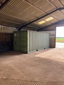 Shipping container in a barn