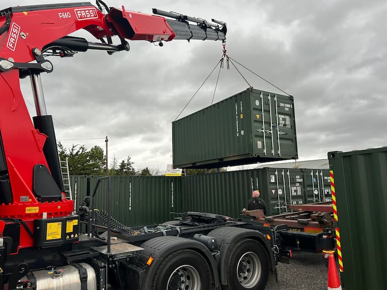 HIAB lorry delivering shipping container