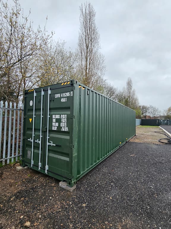 40ft container in dark green at self storage site