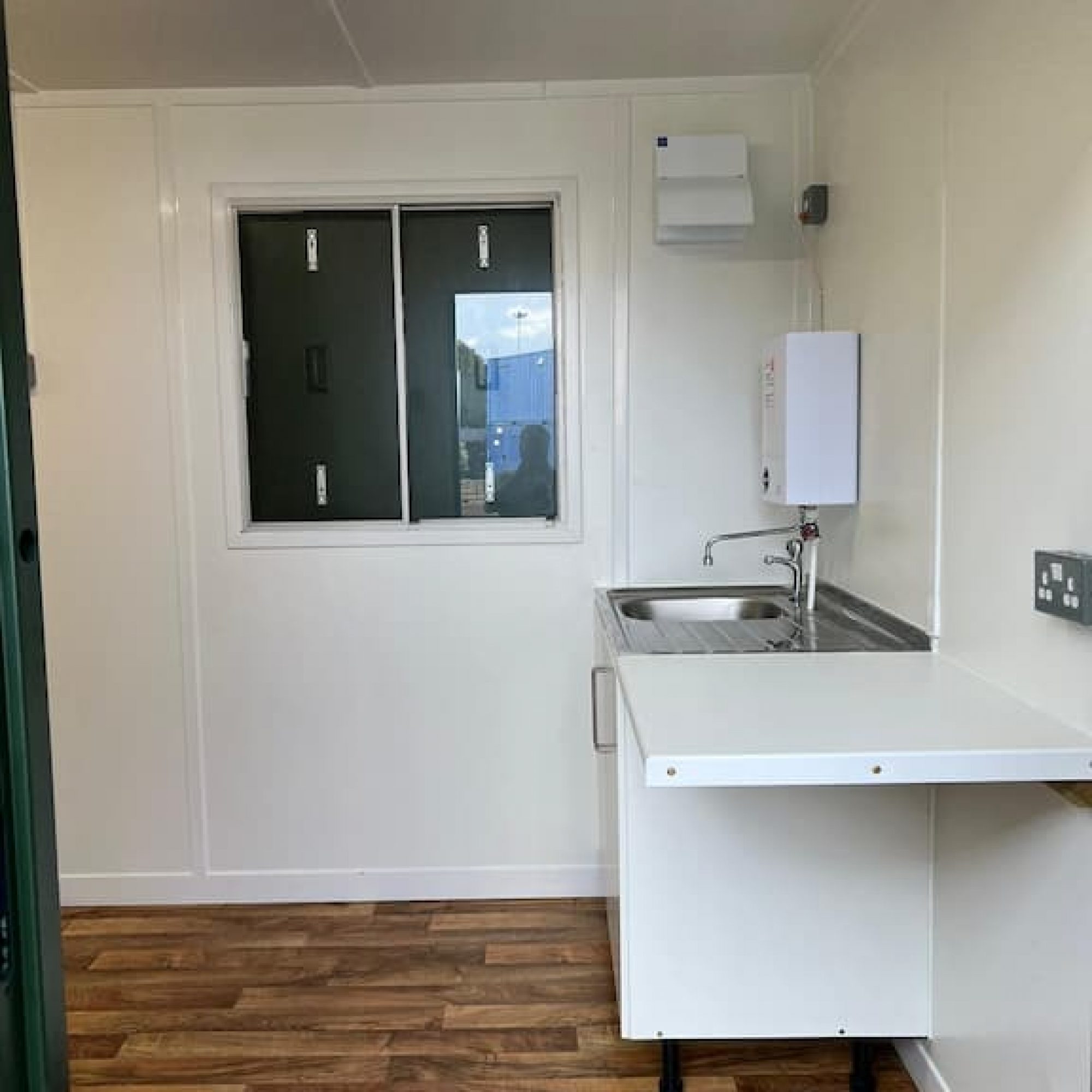 sink and hot tap in a container office