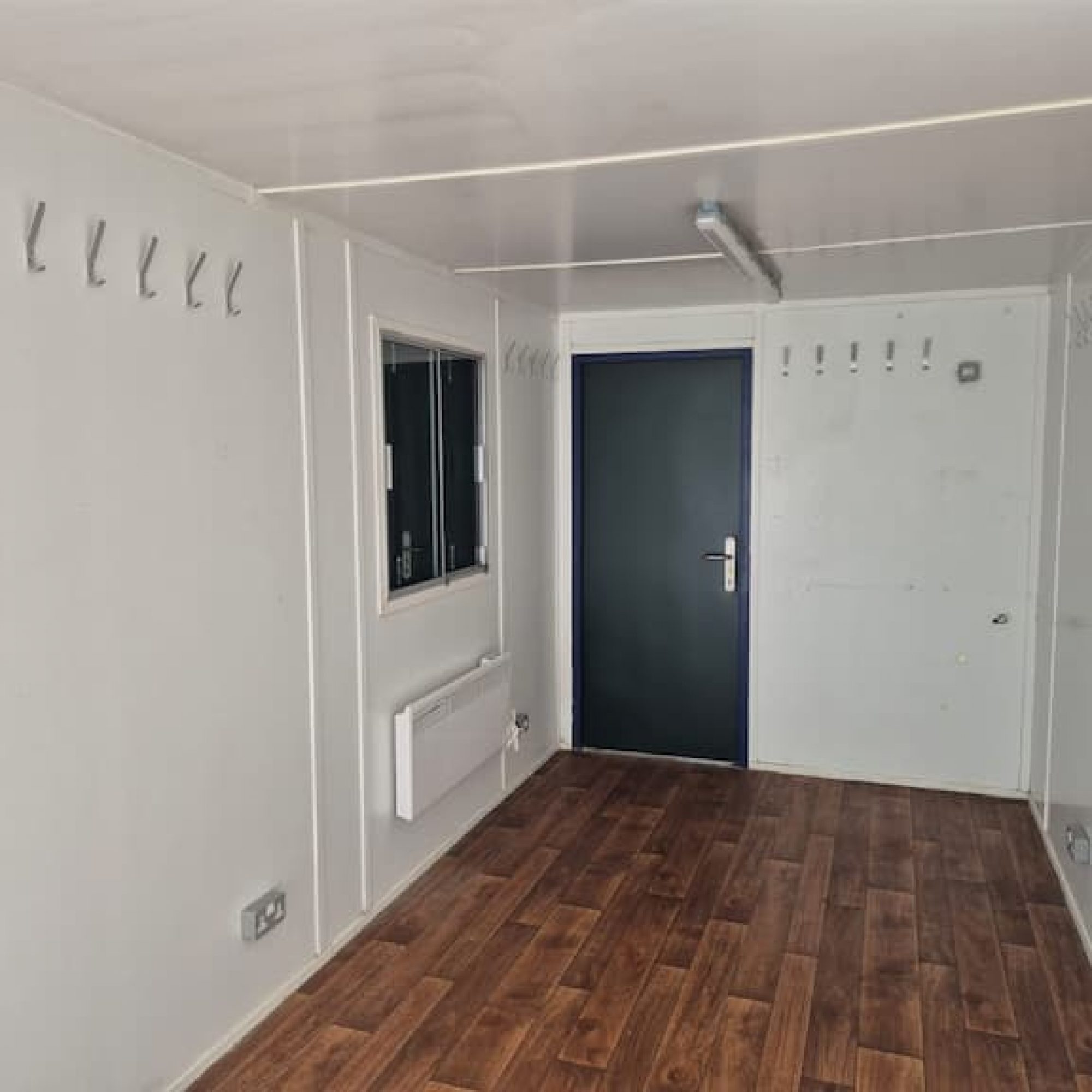shipping container being used as a office interior