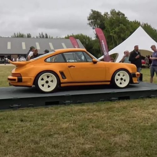 car on a platform flat container