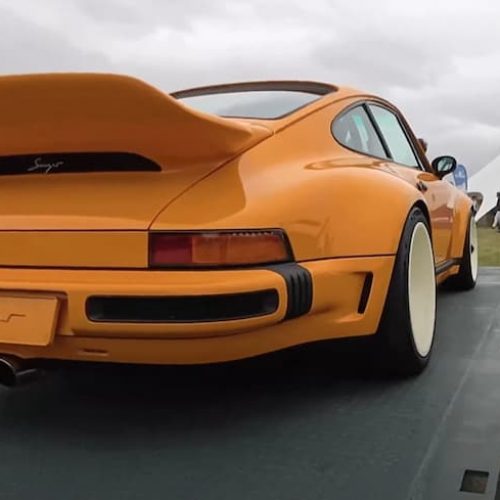 Classic Porsche on a platform flat container